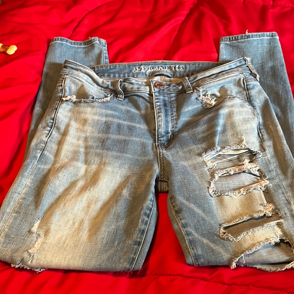 American Eagle jeans 12R worn,holes ,straight legs Strech jeans